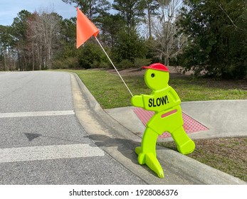 Slow sign at school areas to warn drivers to slow down!