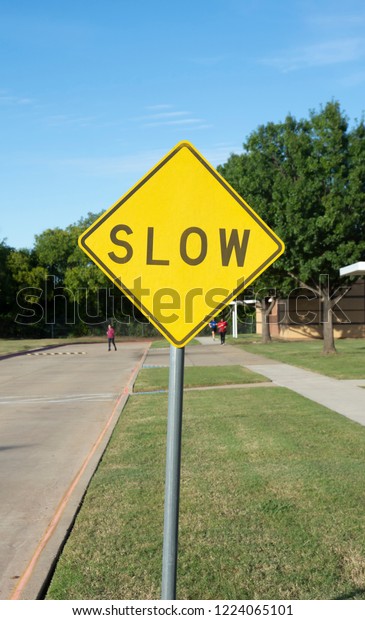 slow traffic sign on site road
