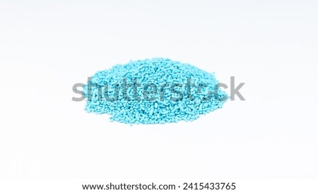 Slug and snail control ferric phosphate blue pellets on white isolated background