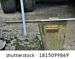 The slump test is the process of testing the value of the collapse / dropping of the concrete mix sample from the height of the truncated cone