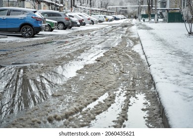 Slush On The Road During Winter Snowfall.