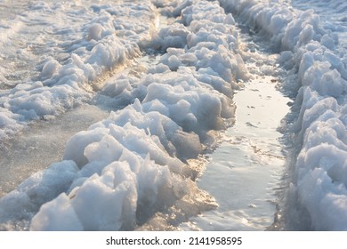 Slush And Puddles In The Snow.