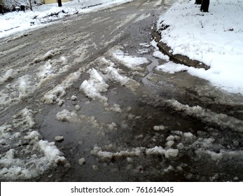 Slush With Puddles And Wet Snow In The Winter