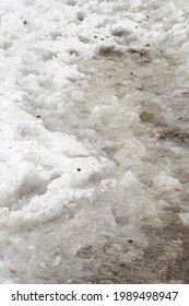 Slush And Trampled Snow With Water.