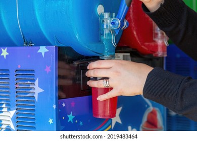 A Slushie Drink Or Slush Puppy Iced Drink Being Poured From A Machine Into A Plastic Cup