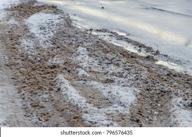 Slushy Snow With Mud On The Road.