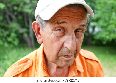 Sly Elderly Man Smiling