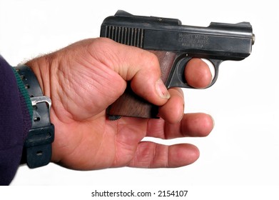 Small 25 Caliber Semi-automatic Pistol In A Large Hand