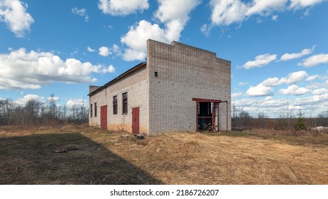 A Small Abandoned Brick Industrial Building Outside During The Day