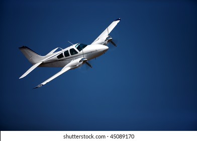 Small Airplane Against Blue Sky