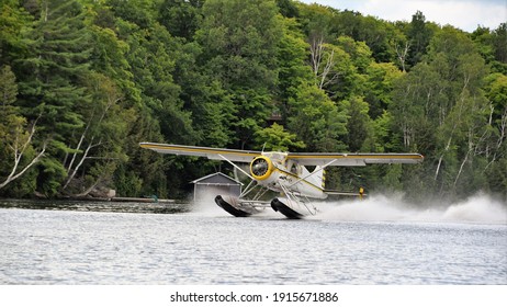 Small Airplane Landing On A Water