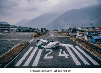 Small airplane to preparing take off drom Lukla airport or tenzing - Hillary Airport, the most dangerous airport in the world solo Khumbu region Nepal. - Powered by Shutterstock