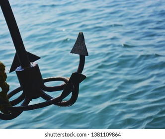 A small anchor aids big ships to keep the hold in the ocean. - Shutterstock ID 1381109864