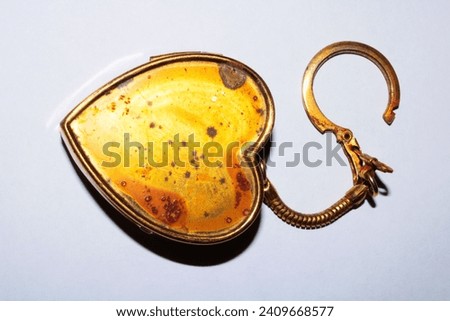 Small antique gold heart-shaped pendant (and keychain)