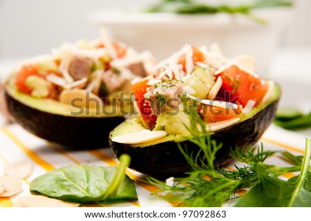 Small Appetizer Sized Paleo Salads Served in Halved Avocados