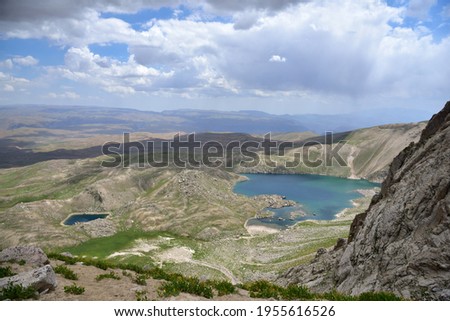 Small Arashan and Upper Arashan lakes and the view of the latitudes of the Chatkal Valley. View about at an altitude of 3300 meters above sea level. Namangan region, Uzbekistan