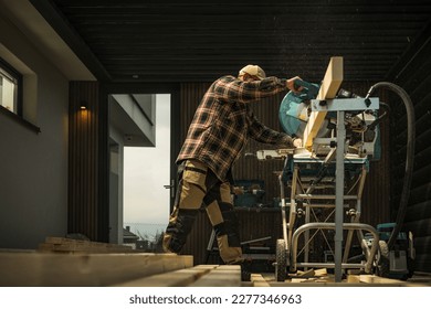 Small Architecture Woodwork Project. General Construction Worker Cut Wood Material To Size using Powerful Saw Machine. - Shutterstock ID 2277346963
