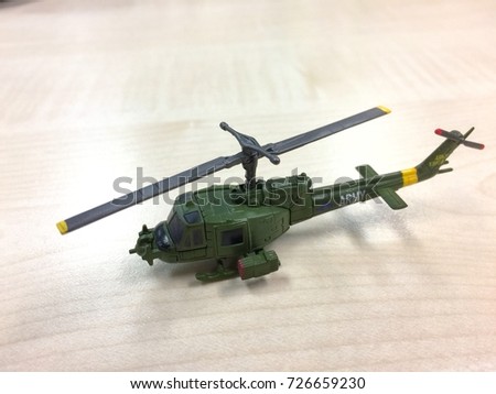 Small army helicopter hobby model toy on the table