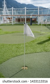 Small Artificial Putting Green For Golf Practice On The Deck Of A Cruise Ship