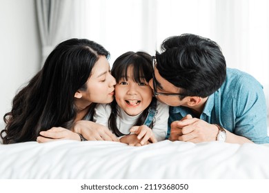 
Small Asian Family Portrait At Home