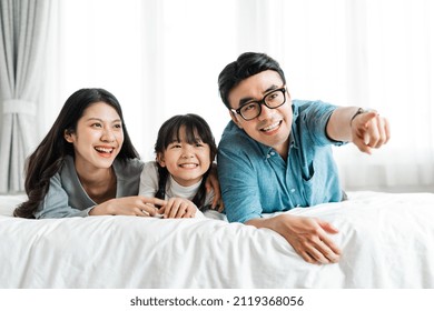 
Small Asian Family Portrait At Home