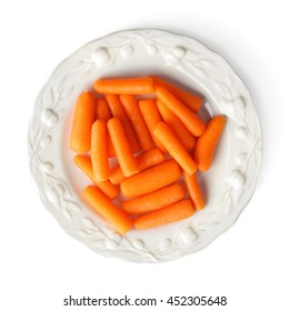 Small Baby Carrots In Plate On White Background