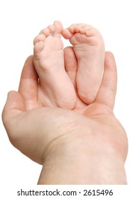 Small baby feet in a man's hand