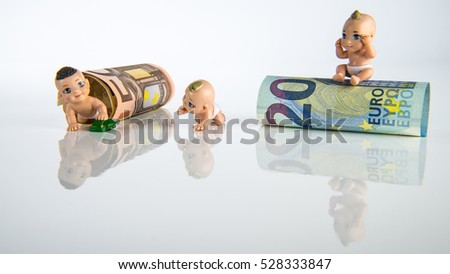 Small baby toys and euro money with white background, children figures with euro bank notes