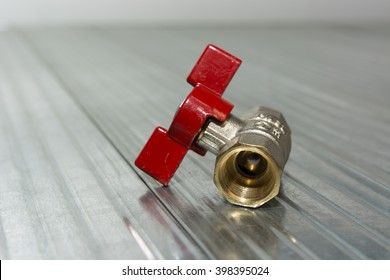 Small ball valve with red butterfly handle