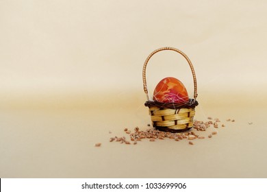 Small basket with painted Easter egg