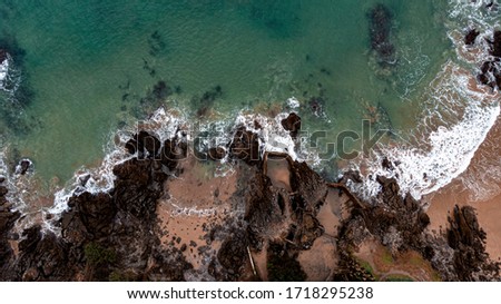 Similar – Aerial Drone View Of Dramatic Ocean Waves Crushing On Rocky Landscape