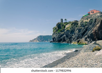 A small beach on summer day in Vernazza, Italy