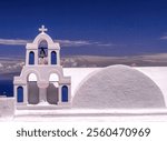 Small bell tower in Oia on Santorini. Oia is located on the north-western coast of Santorini.