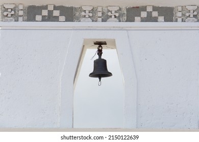 A Small Bell In A White Colonial Style Tower. City Hall Bell In Mexico. Spanish Colonial Architecture.