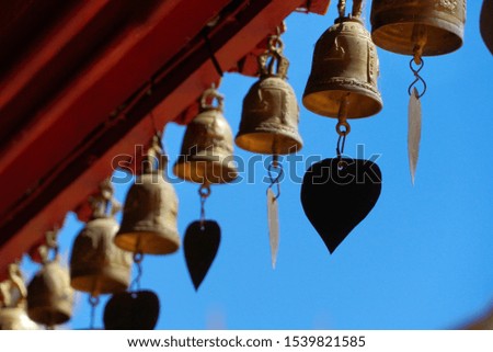 Small bells hang on roof in the temple 