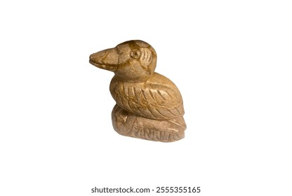 A small, bird-shaped sculpture made of a brown, stone-like material. The bird has a detailed beak, eyes, and feathers, carved into the stone.  - Powered by Shutterstock