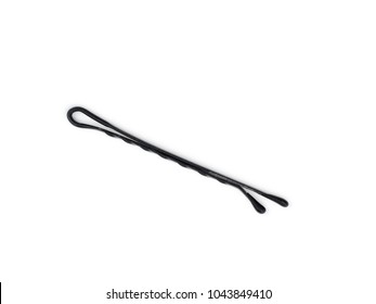 Small black metal hairpin on white background.