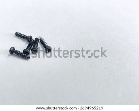 Small Black Screws for Assembling Small Electronic Components, Especially on Computers, Laptops, or Hard Drives