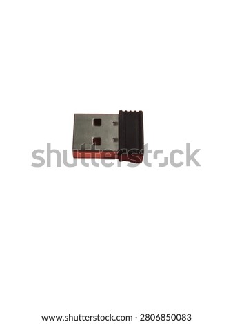 A small black wireless USB receiver dongle isolated on a clean white background studio shot.