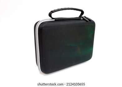 A Small Black Zipper Bag With A Handle And A Green Sheen On A Light Background