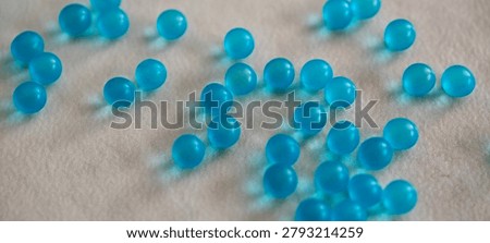Small blue 3D round particles left undisturbed on the countertop