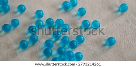 Small blue 3D round particles left undisturbed on the countertop