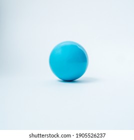 A small blue ball on a white background - Powered by Shutterstock