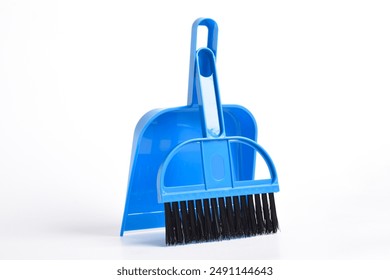 Small blue broom and dustpan set isolated on white background - Powered by Shutterstock