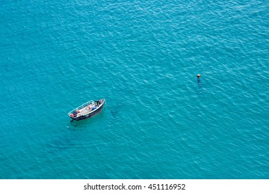 Small Boat On The Sea, Aerial View,  In Guernsey