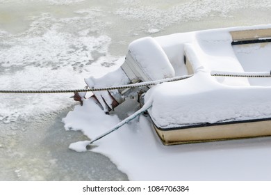 A Small Boat Stuck In Ice In Stockholm On A Cold Winter Day