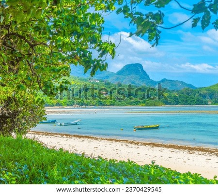 Small boats in Anse a la mouche beach. Mahe island, Seychelles
