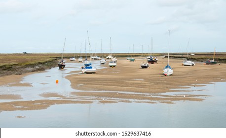 Small boats at low tide at Wells next the Sea, Norfolk, UK - Powered by Shutterstock