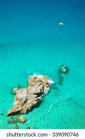 Small boats on the crystal clear sea  near the town of Tropea region Calabria - Italy