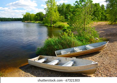 Small Boats on Shore: Small fishing boats wait on the shore of a Wisconsin lake.